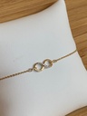 Bracelet Infini en or jaune 18ct avec zircons