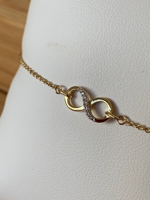 Bracelet Infini en or jaune 18ct avec zircons