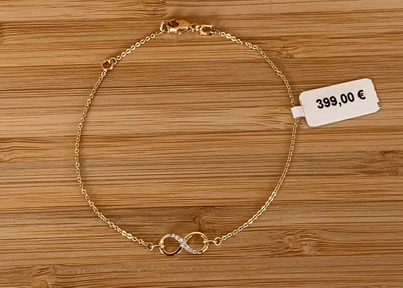 Bracelet Infini en or jaune 18ct avec zircons